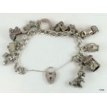 Silver charm bracelet and 11 charms 58gm