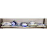 A quantity of blue and white china to include Oriental and Willow pattern