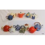 A collection of 12 Teapots