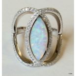 A silver cz and white opal dress ring