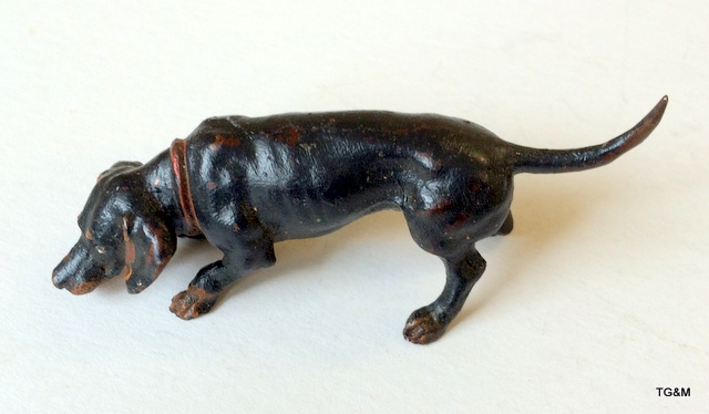 A cold painted bronze dog