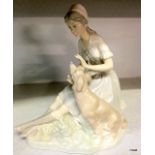 A Lladro style figure lady with a dog 20cm high