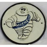 A round cast Michelin sign