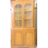 A double door corner glazed display cabinet