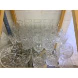 A large quantity of crystal and cut glass to include brandy glasses, whisky tumblers and water