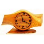 An impressive WW1 trench art mantle clock made from a wooden propeller boss and standing on a