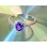 An 18ct white gold amethyst and diamond ring