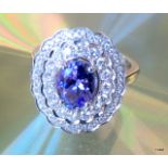 An 18ct white gold tanzanite and diamond cluster ring of 1.9ct's