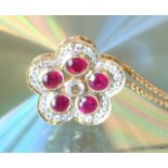 An 18ct yellow gold ruby and diamond pendant necklace of 1.55ct's