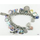 Silver charm bracelet and 24 charms