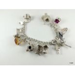 Silver charm bracelet and 13 charms