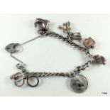 Silver charm bracelet and 6 charms