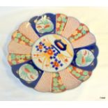 A Japanese Imari plate with wavy rim edge