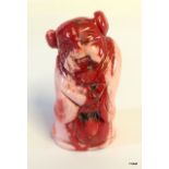 A red coral Chinese figure