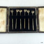 A boxed silver set of hallmarked cocktail sticks in the form of cockerels