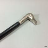 A silver plated horse head walking cane