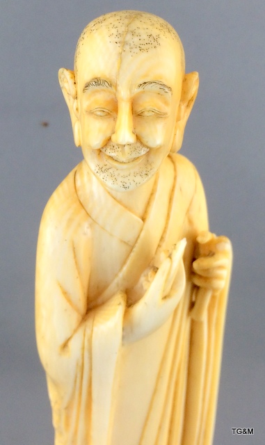 A carved ivory figure of a sage on a wooden stand 20cm high. - Image 2 of 10