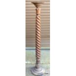 A mahogany barley twist torchere 140cm high