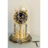 Anniversary clock in glass dome with key