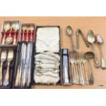 A collection of silver and silver plate to include teaspoons and sugar tongs