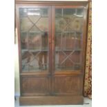 A double glazed book cupboard in mahogany 192 x 127 x 38cm