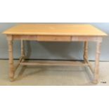 A single drawer limed oak writing desk