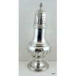 A large solid silver sugar castor 2cm high with flame finial. 210g