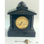 A slate chiming mantle clock