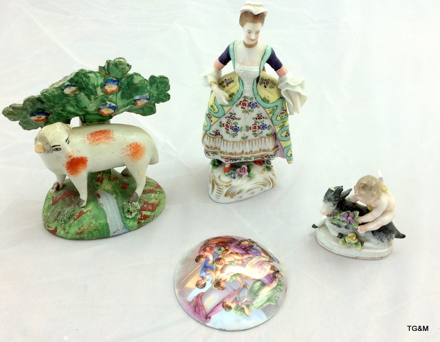 An old Staffordshire model of a sheep, a cherub, porcelain plaque and a model of a lady (possibly