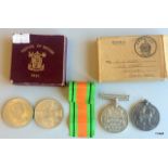 A 1939-1945 Defence medal in original postage box and a 1914-1918 medal together with a a Festival