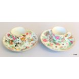 A pair of Chinese porcelain tea cups and saucers with enamelled famille rose decoration, circa 1820