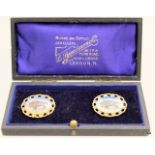 A pair of silver gilt and enamel R.A.O.B Brooches