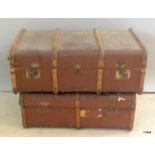 A pair of wood bound travelling trunks