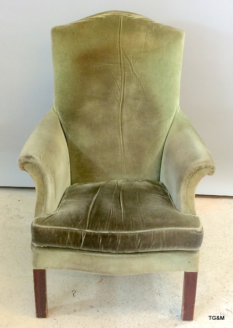 A Parker knoll high backed armchair needs recovering