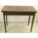 A mahogany open leaf card table on tapered legs (A/F) 74 x 90cm