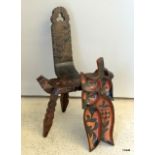 African carved chair and African carved wood serving plate