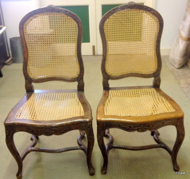 A pair of French Bergere cane chairs