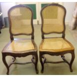 A pair of French Bergere cane chairs