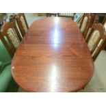 An Extending dining table and 4 chairs