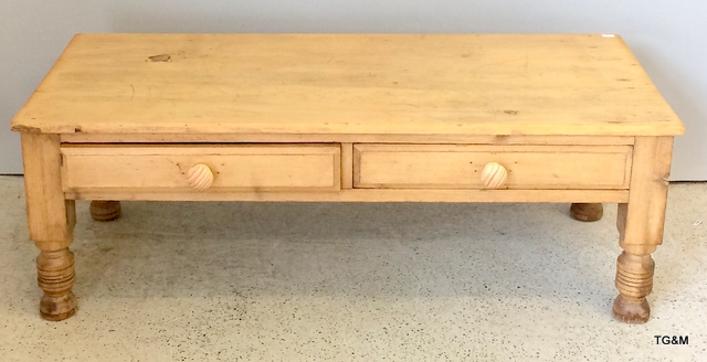 A small pine coffee table with two drawers. 36 x 102 x 49cm