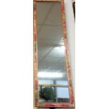 Ornately framed wall dressing mirror
