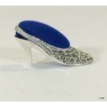 A silver and marcasite pincushion in the form of a shoe