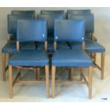 A set of 8 dining chairs with blue Rexine covers