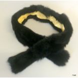 A Black Coonie silk lined pull through scarf