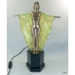 An Art Deco style lamp in the form of a young lady with a cloak