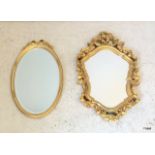 A pair of ornate gilt wall mirrors