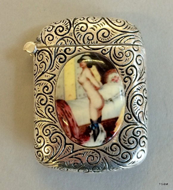 A silver plated vesta case with nude images
