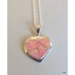 A silver and pink opalite heart shaped pendant necklace