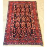 An Iranian Red & Black rug with a dark blue border. 150 x 100cm