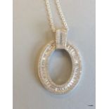 A large silver and CZ doughnut style pendant necklace